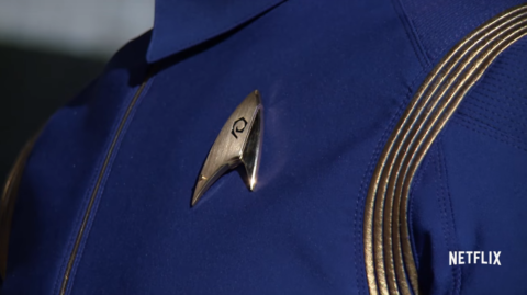 A cleaner shot of the new Starfleet uniforms (thanks Karl!) from the promo as seen on Netflix, where Discovery will air internationally. Check out what is clearly a pip on the lower left of the delta insignia.