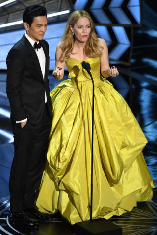 John Cho on stage with actress Leslie Mann onstage during the 89th Annual Academy Awards at Hollywood & Highland Center on February 26, 2017 in Hollywood, California