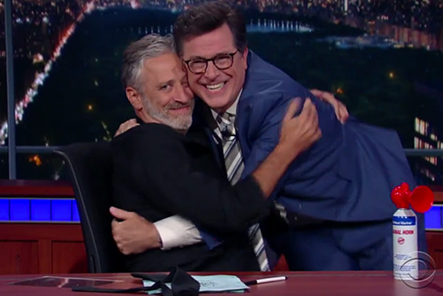 Jon Stewart and Stephen Colbert hugging